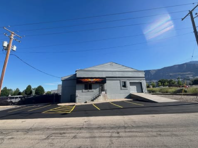 Fresh asphalt patch repair on a Utah Valley parking lot