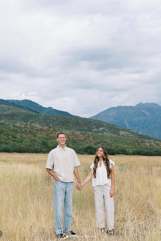 Campbell's Coatings owners standing together in a Utah Valley field